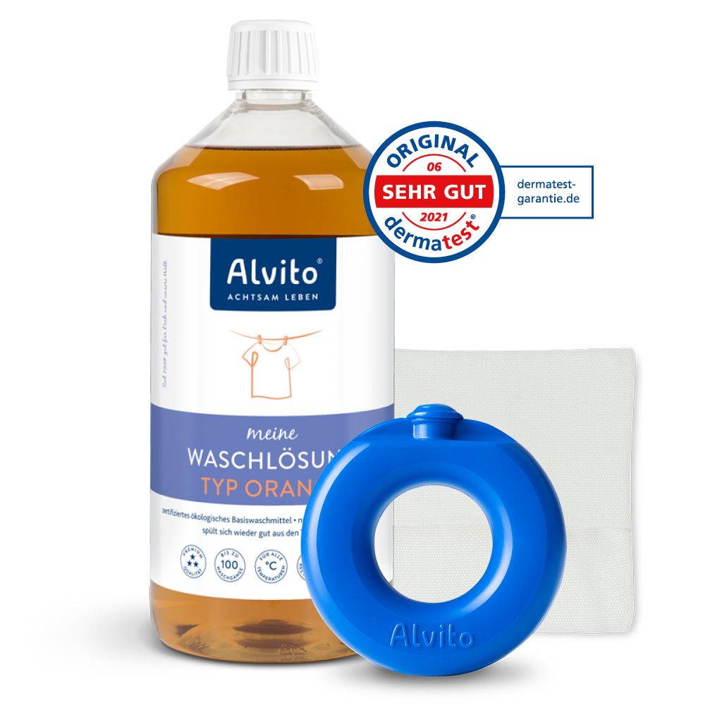 Abgebildet ist das Alvito Waschsystem Startset von Alvito mit weißem Tuch und Waschring sowie einem "SEHR GUT" Dermatest-Siegel in der rechten oberen Ecke. Das Produkt ist als ECOCERT Basiswaschmittel zertifiziert.